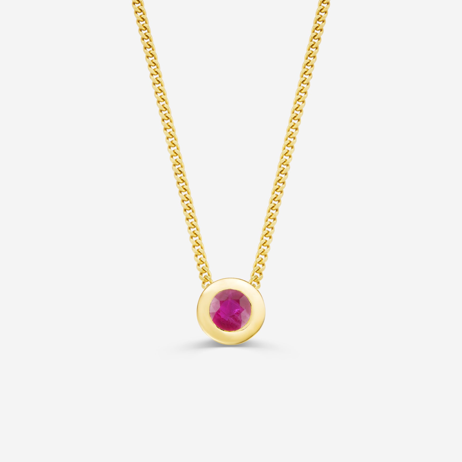 9ct yellow gold necklace with a round ruby pendant on an off white background