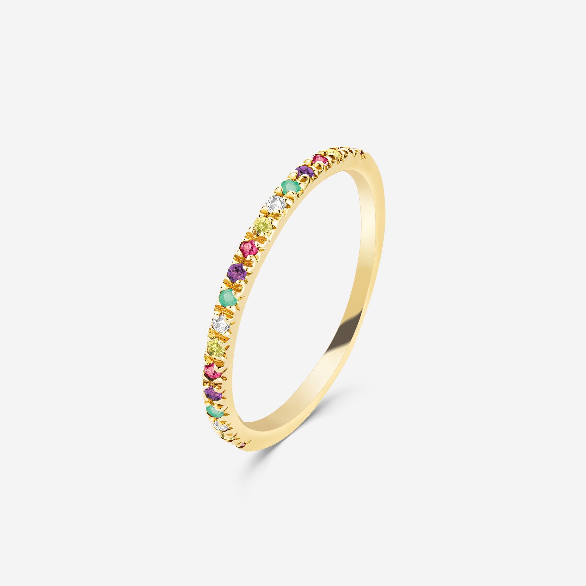 14ct yellow gold half eternity ring with colorful gemstones on an off white background