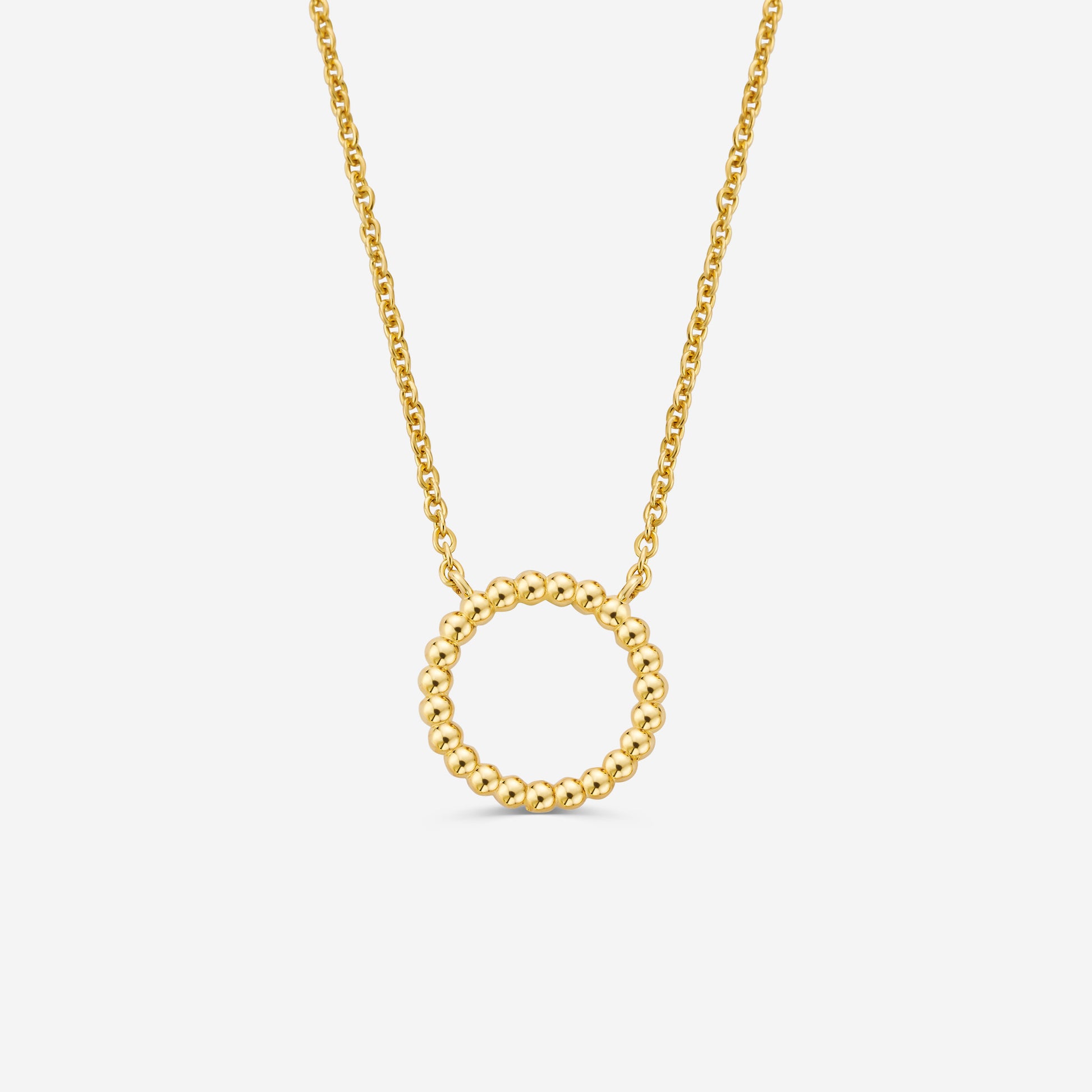 14ct gold necklace with a circular beaded pendant on a off white background