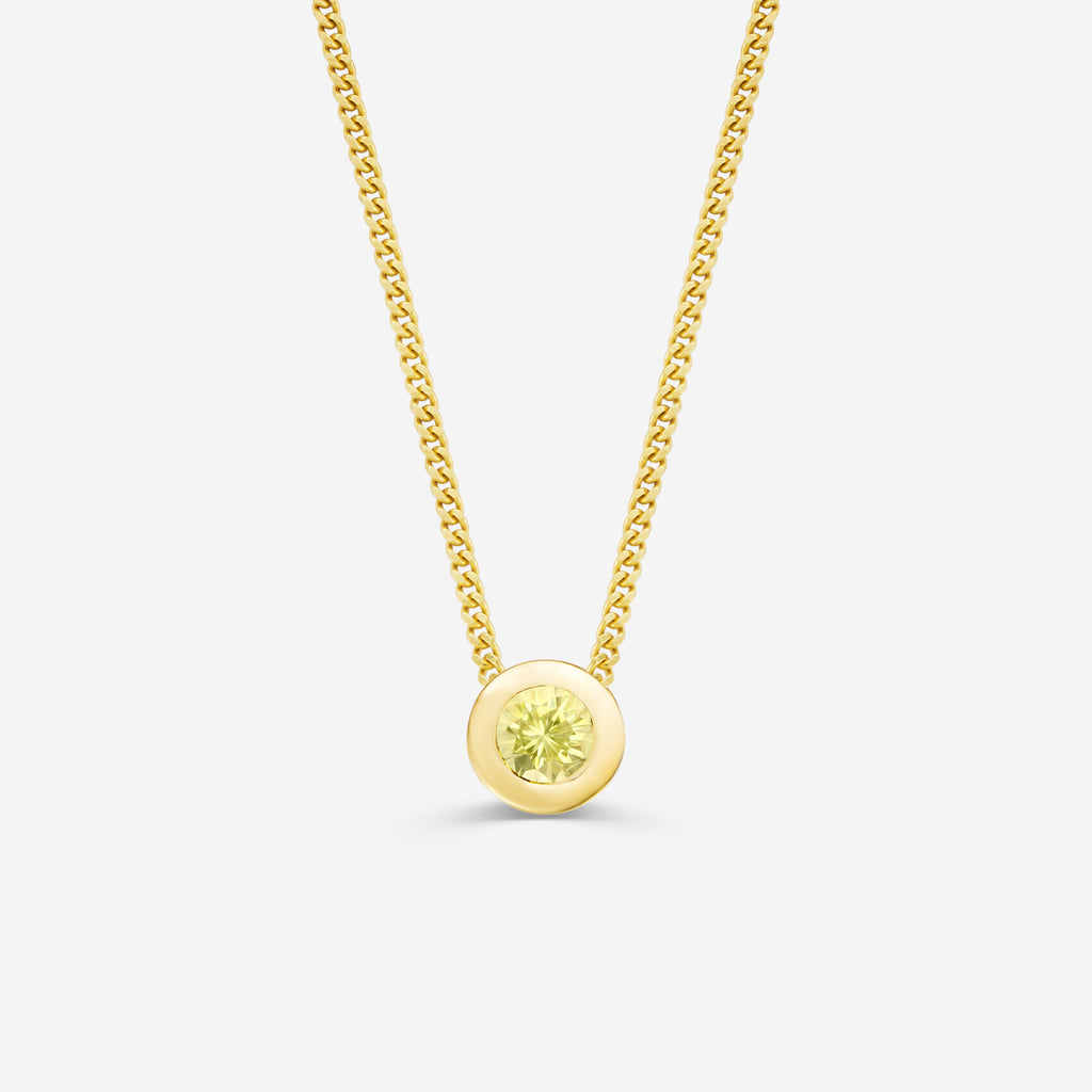 9ct yellow gold necklace with a round citrine pendant on an off white background