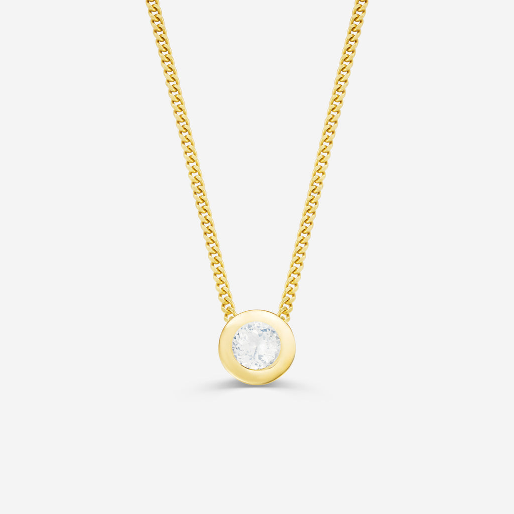 9ct yellow gold necklace with a round diamond pendant on an off white background