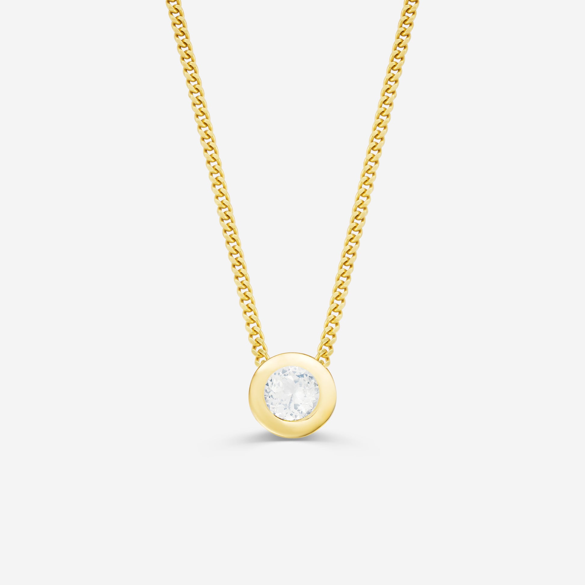 9ct yellow gold necklace with a round diamond pendant on an off white background