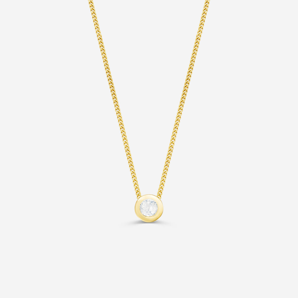 9ct yellow gold necklace with a round diamond pendant on an off white background