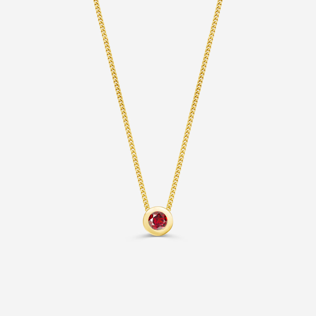 9ct yellow gold necklace with a round garnet pendant on an off white background