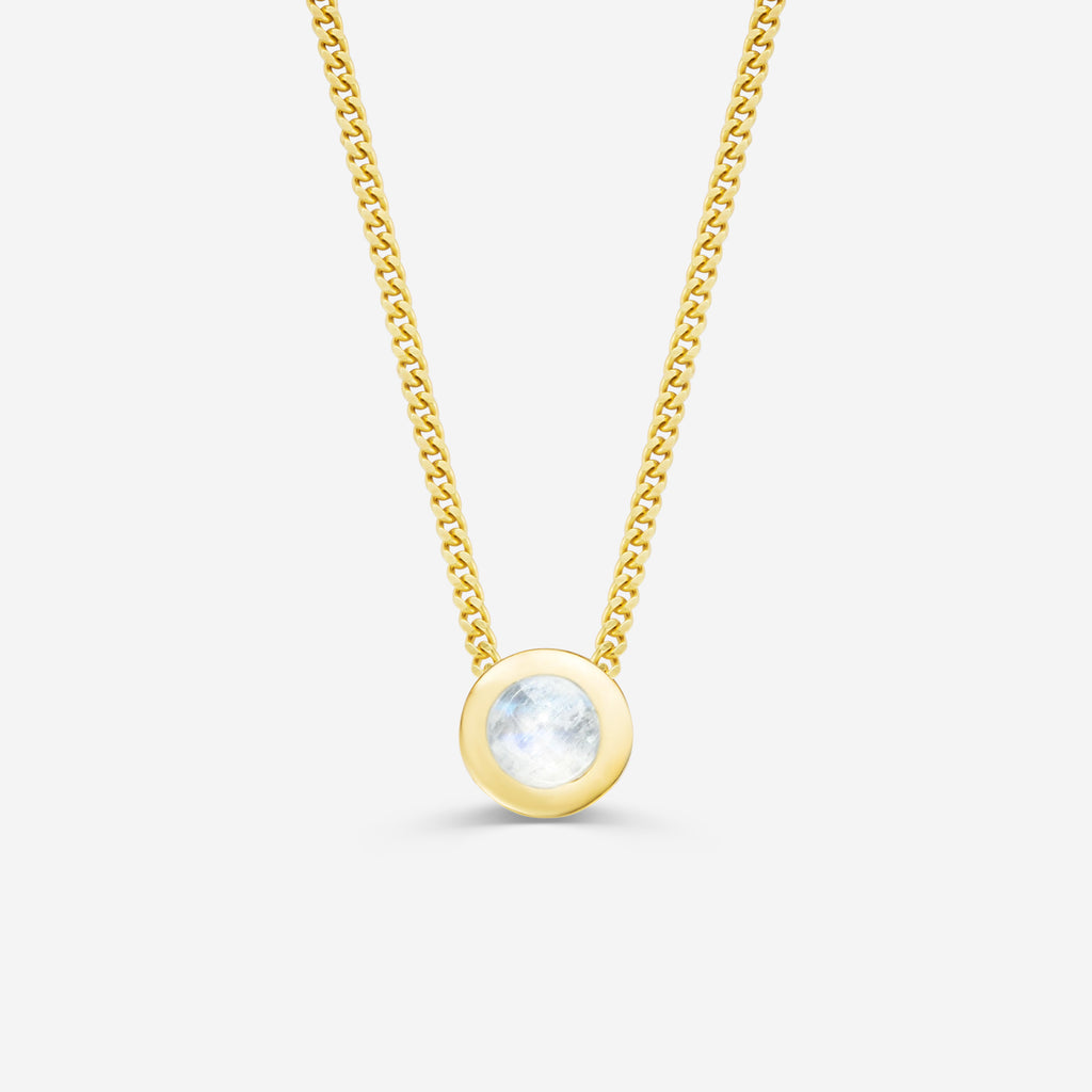 9ct yellow gold necklace with a round moonstone pendant on an off white background