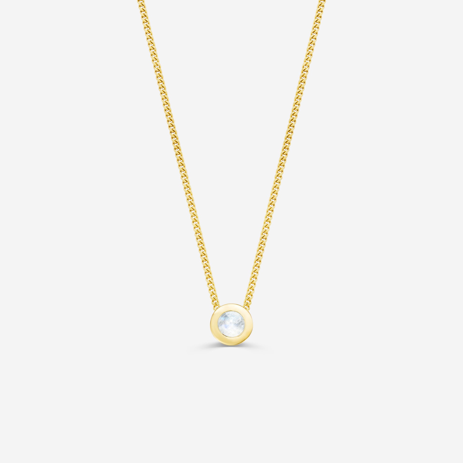 9ct yellow gold necklace with a round moonstone pendant on an off white background