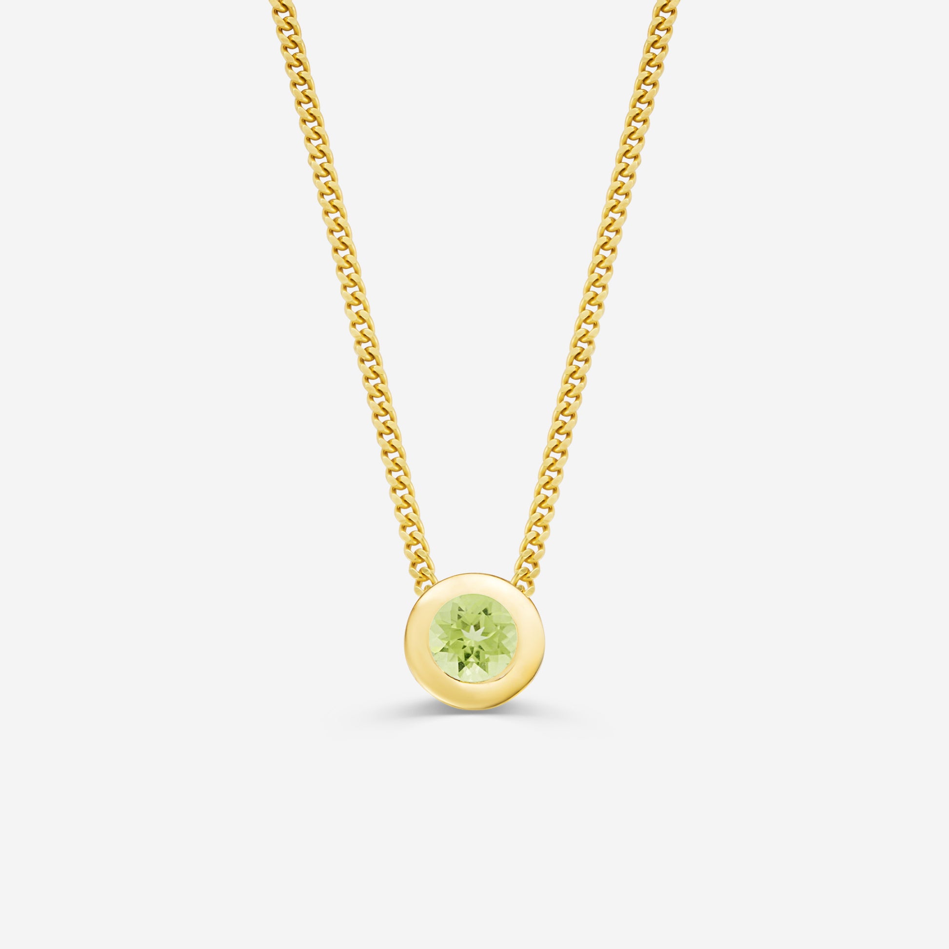 9ct yellow gold necklace with a round peridot pendant on an off white background