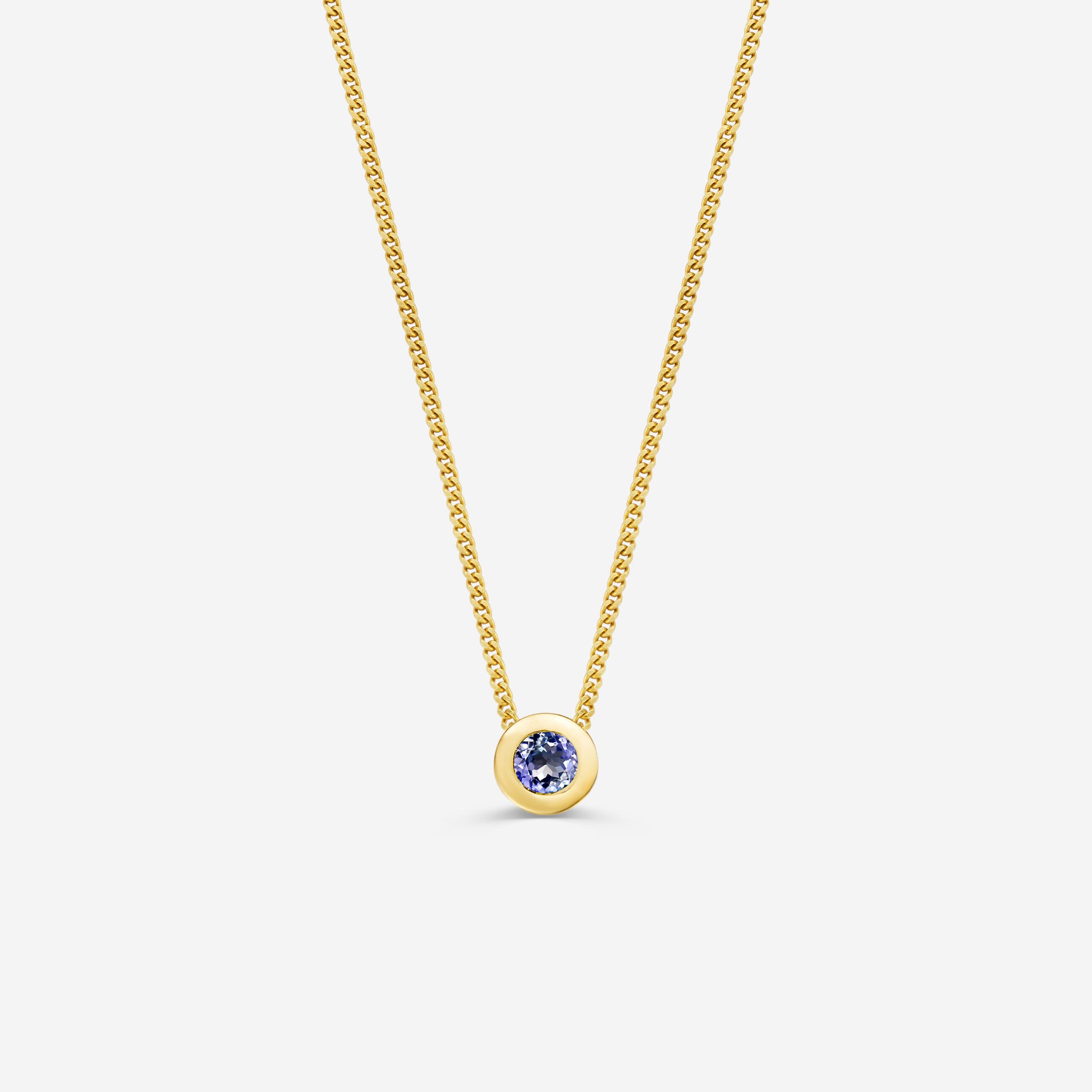 9ct yellow gold necklace with a round tanzantite pendant on an off white background