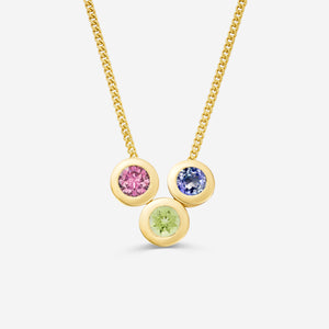 9ct yellow gold necklace with three round gemstone pendants on an off white background