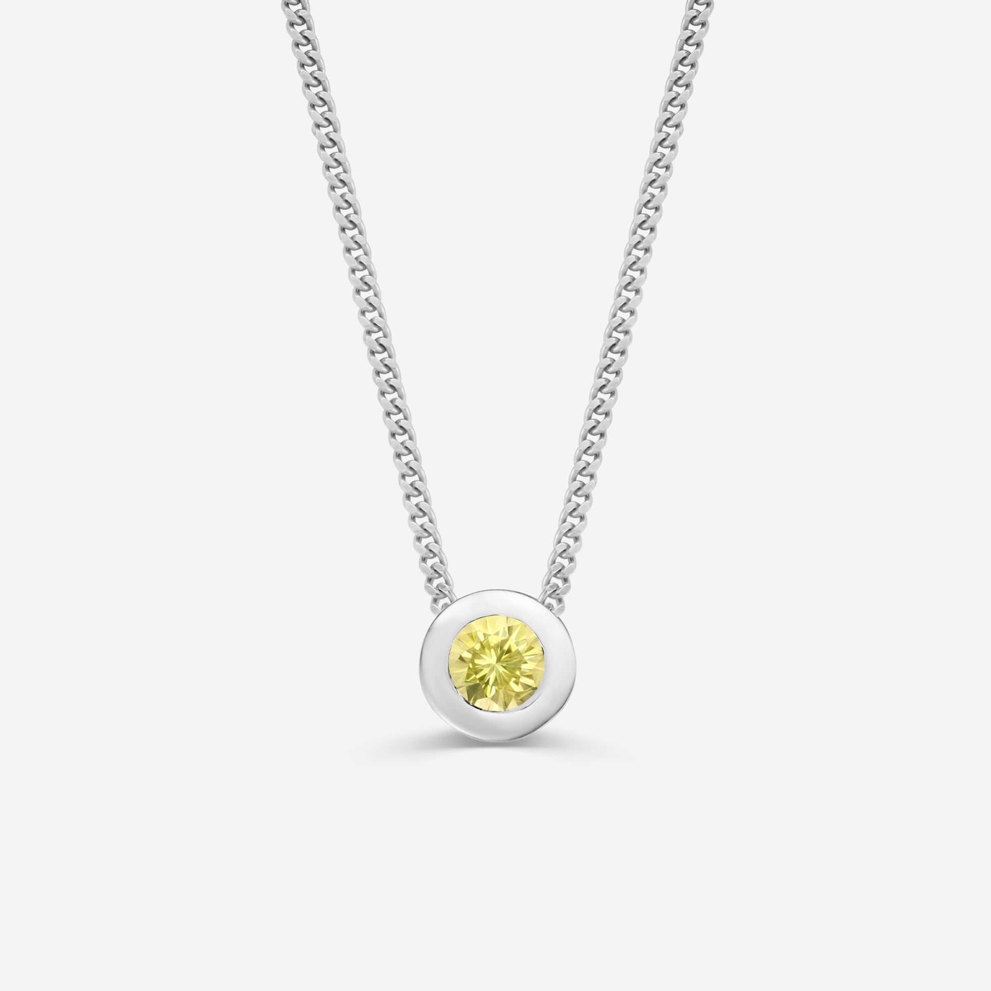 9ct white gold necklace with a round citrine pendant on an off white background