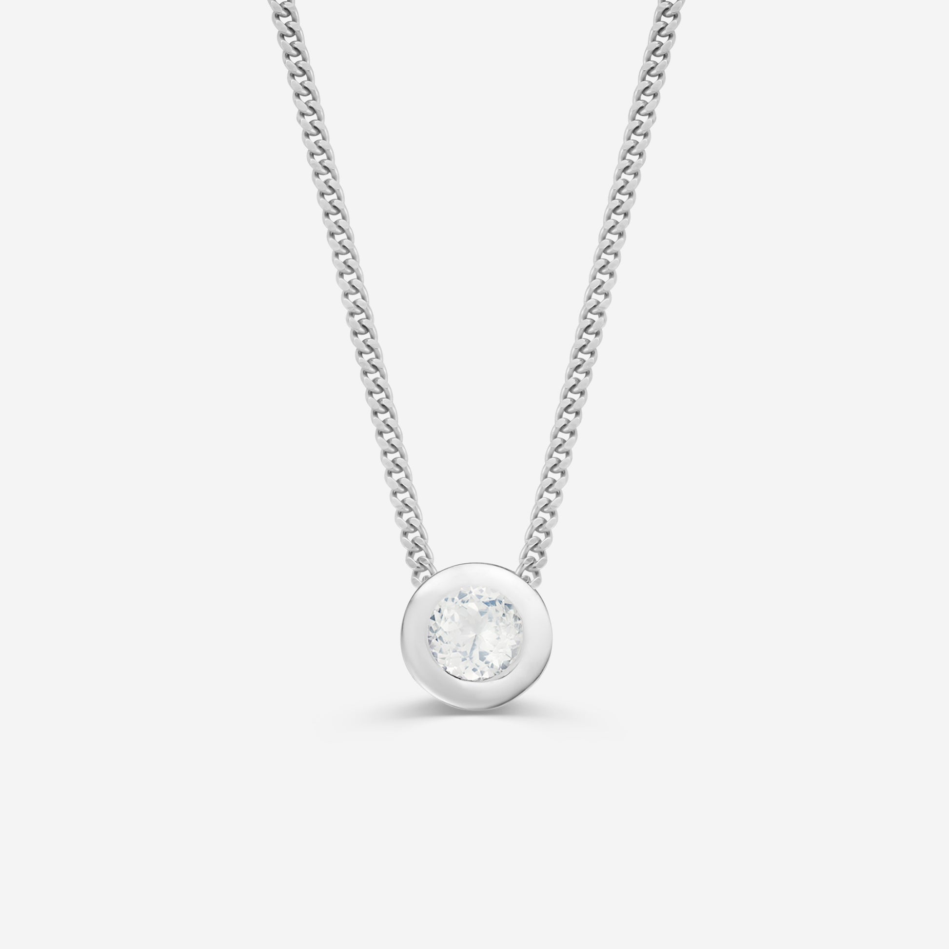 9ct white gold necklace with a round diamond pendant on an off white background