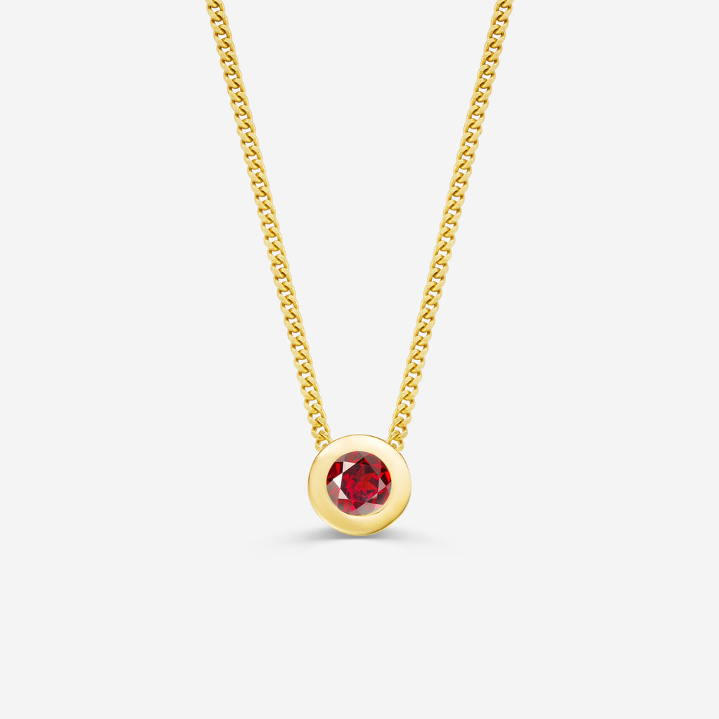 9ct yellow gold necklace with a round garnet pendant on an off white background