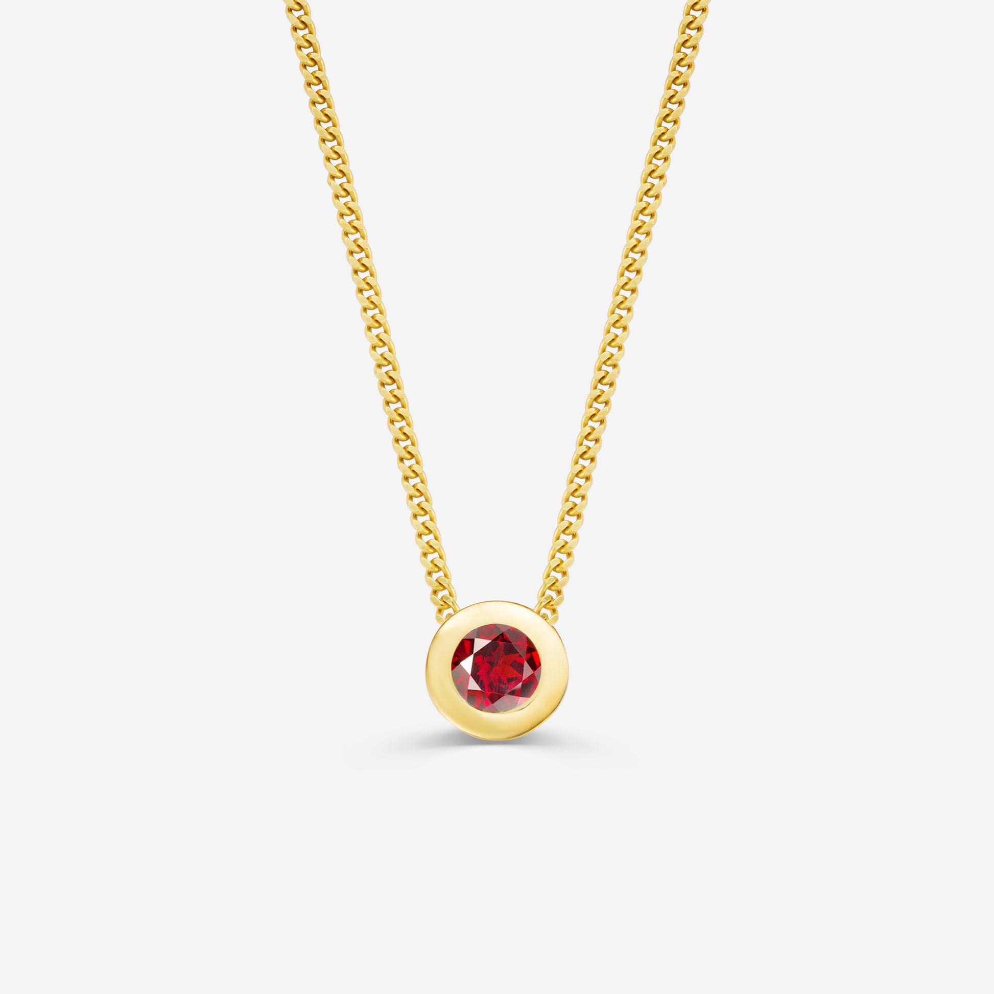 9ct yellow gold necklace with a round garnet pendant on an off white background