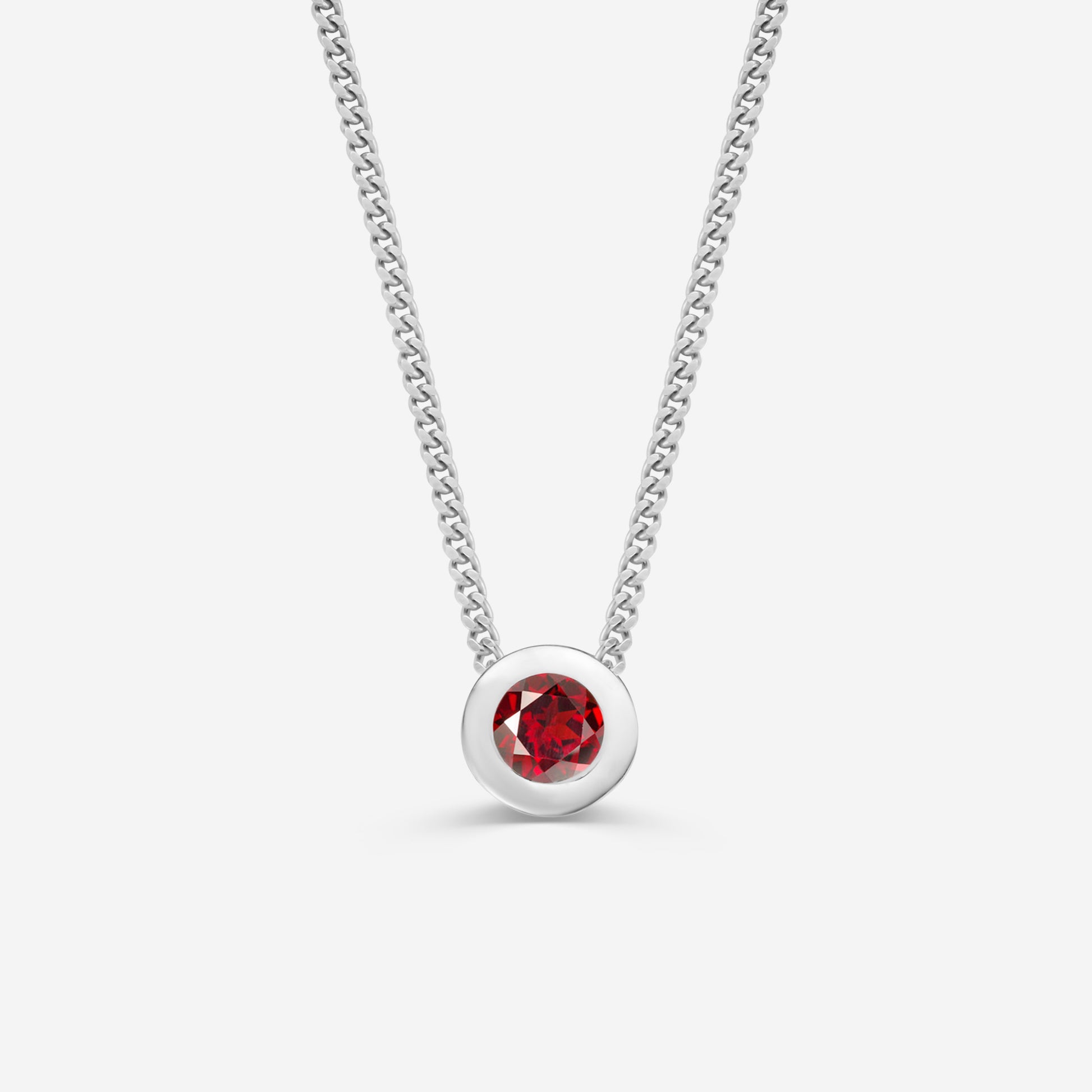 9ct white gold necklace with a round garnet pendant on an off white background