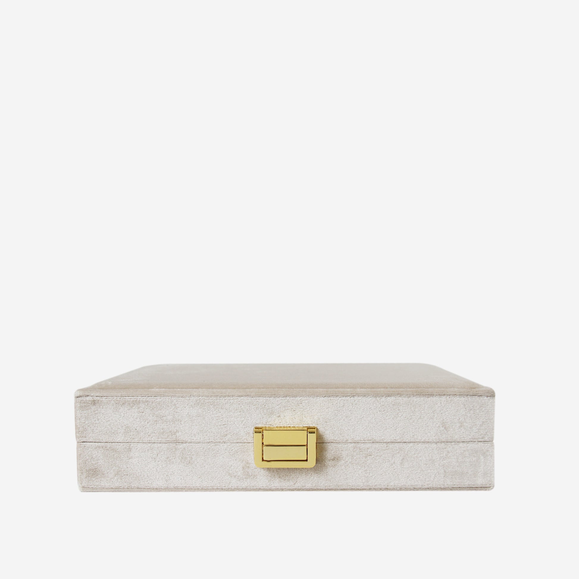 Champagne velvet closed jewellery box on an off white background