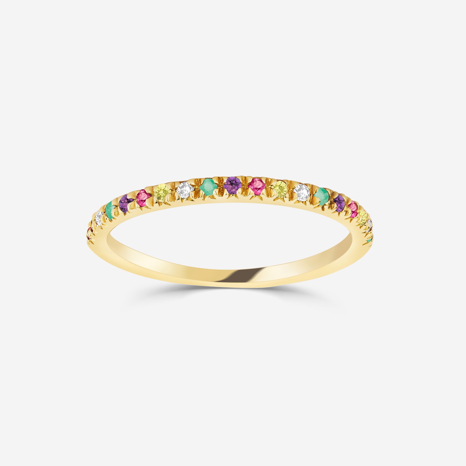 14ct yellow gold half eternity ring with colorful gemstones on an off white background