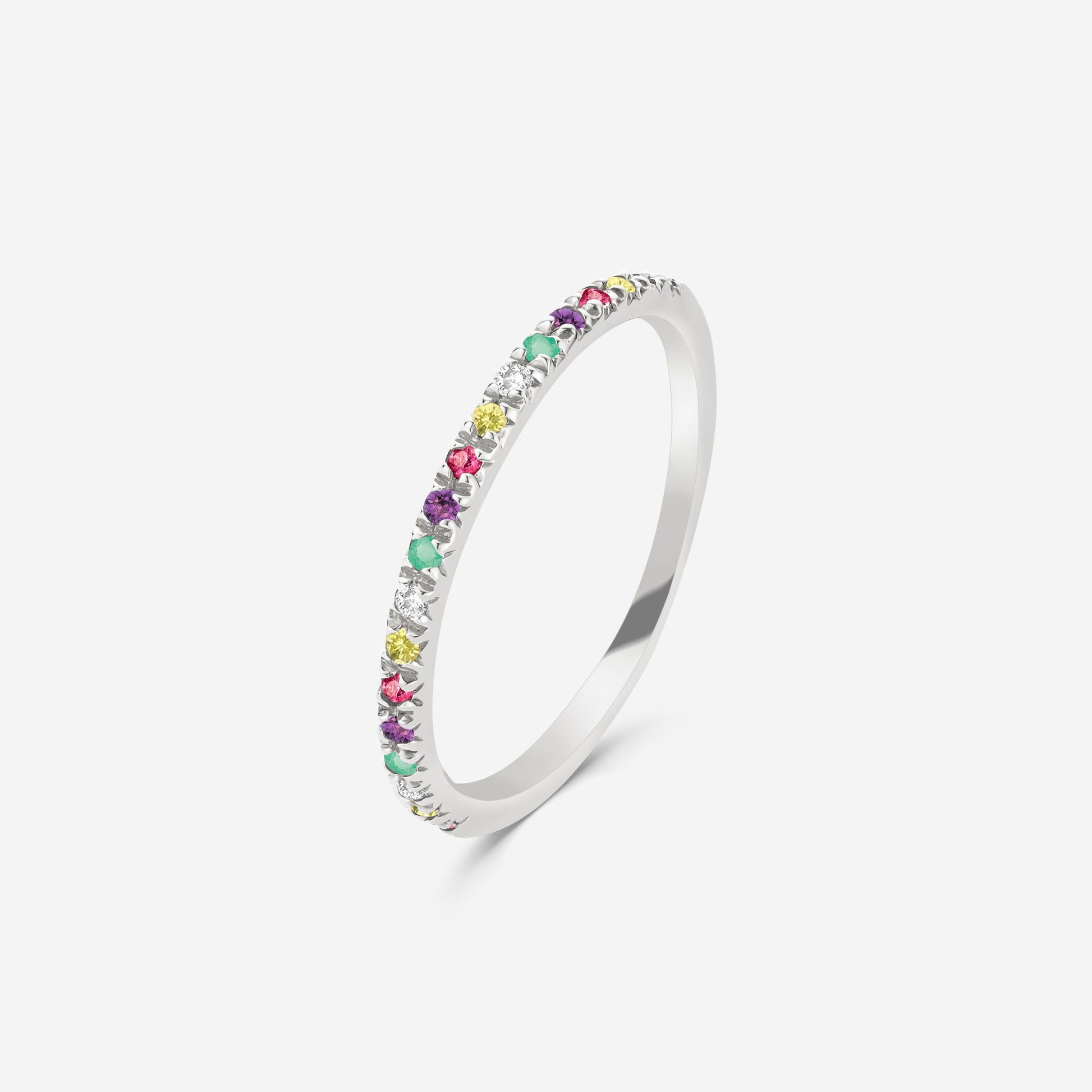 14ct white gold half eterity ring with a mixture of  multicolored gemstones on a white background