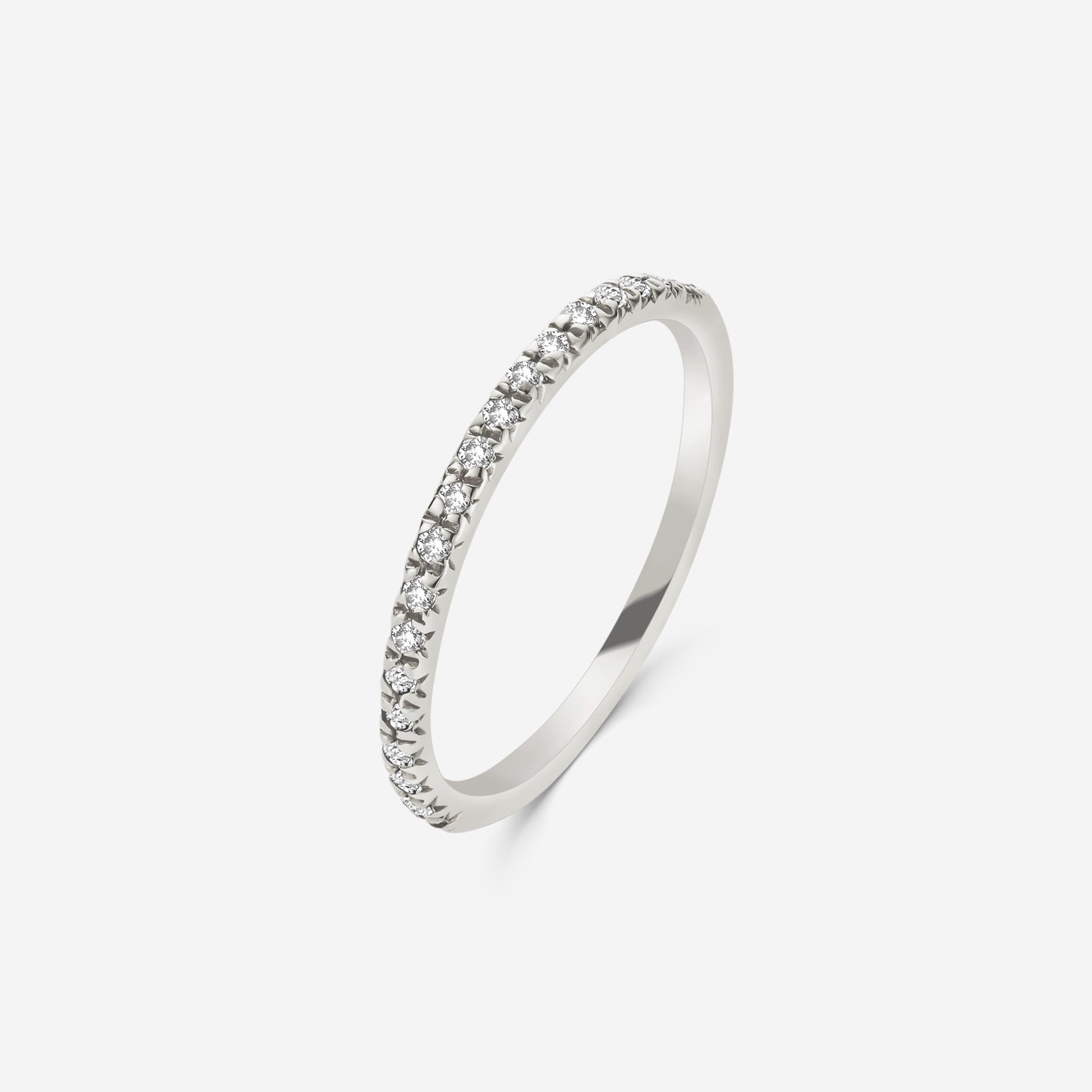 14ct white gold half eternity ring set  with diamonds on an off white background
