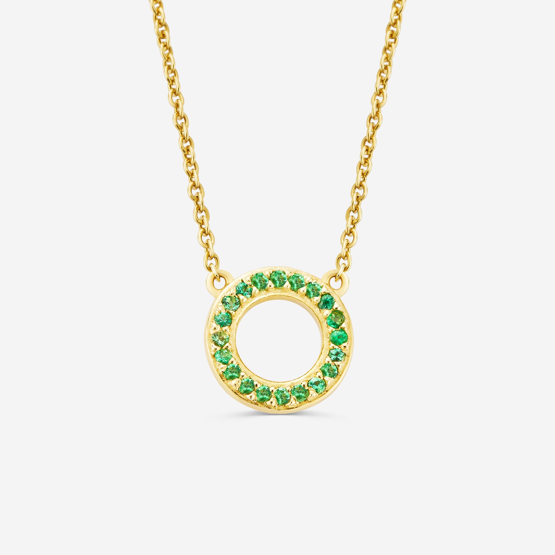 14ct yellow gold eternity necklace with a green emerald gemstone pendant on an off white background