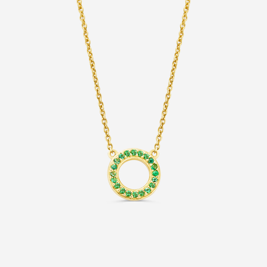 14ct yellow gold eternity necklace with a green emerald gemstone pendant on an off white background