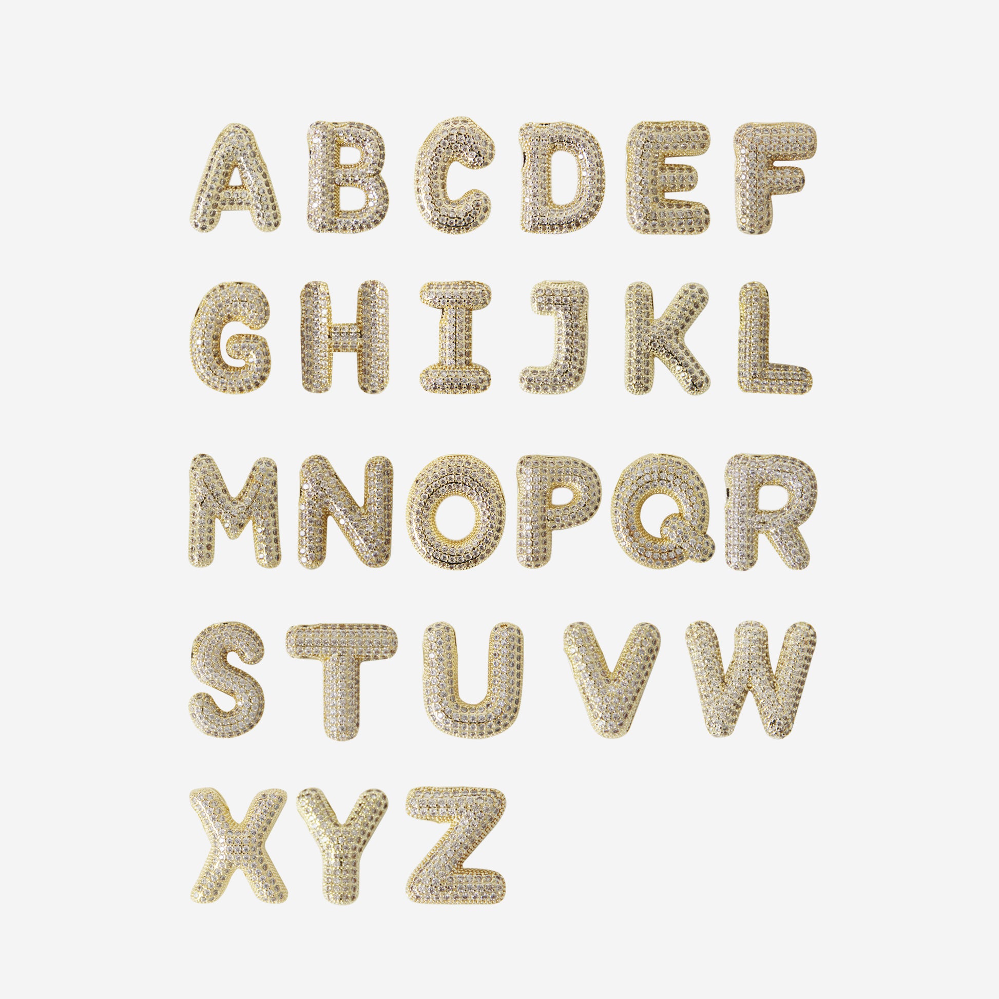 Gold and crystal alphabet letters on a white background
