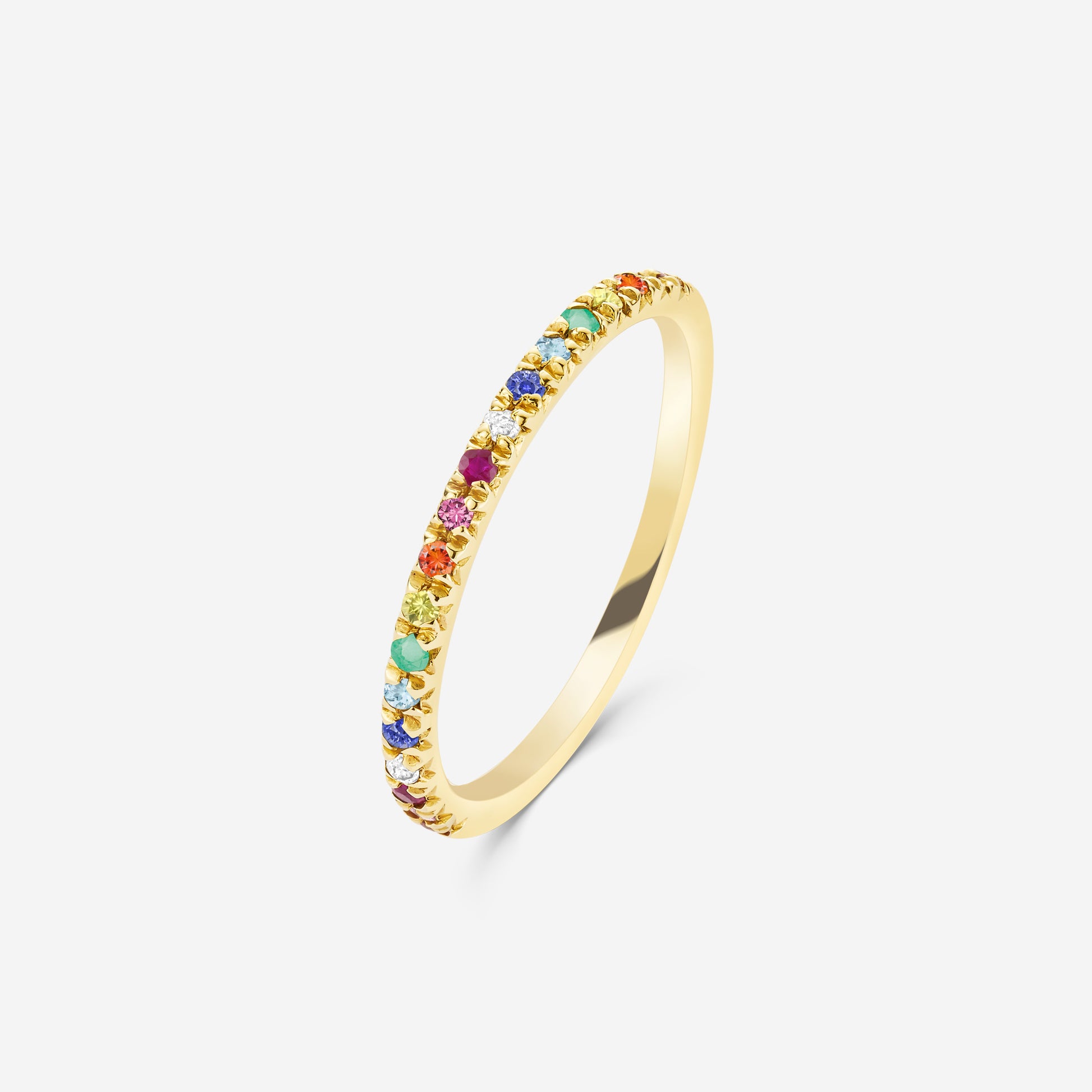 14ct yellow gold  half eternity ring set with a rainbow of gemstones on an off white background